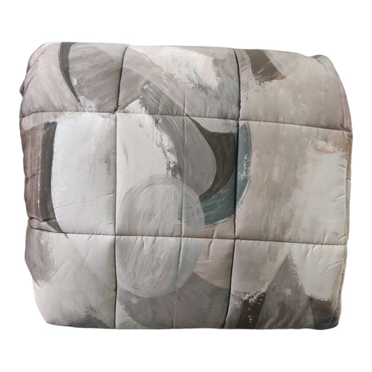 Trapunta Aspen Dondi Home Clorofilla ripiegata, con forme curve ed effetto pittorico