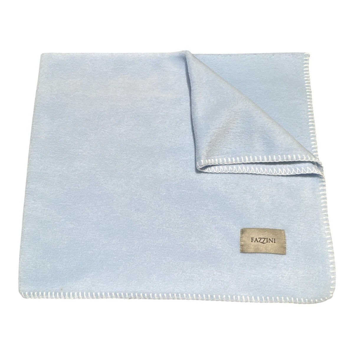 Coperta culla Fazzini Lucy con bordo a punto cavallo ed etichetta del marchio applicata