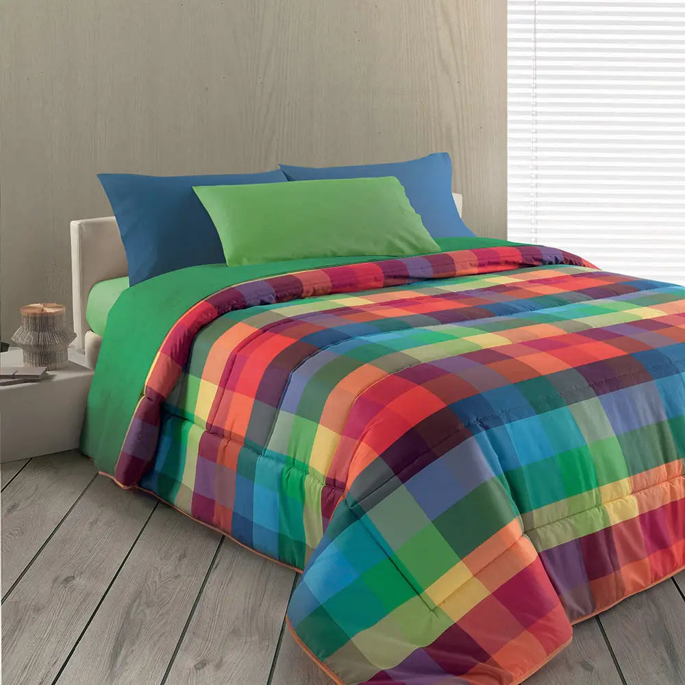 Trapunta Wilson Gabel Joy multicolor ambientata su letto singolo con fantasia geometrica a quadri